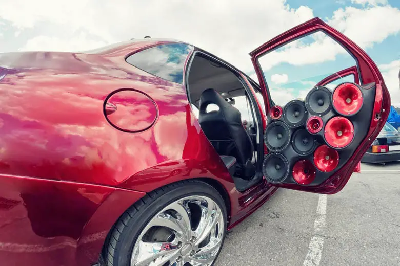 Car playing loud music on parking lot