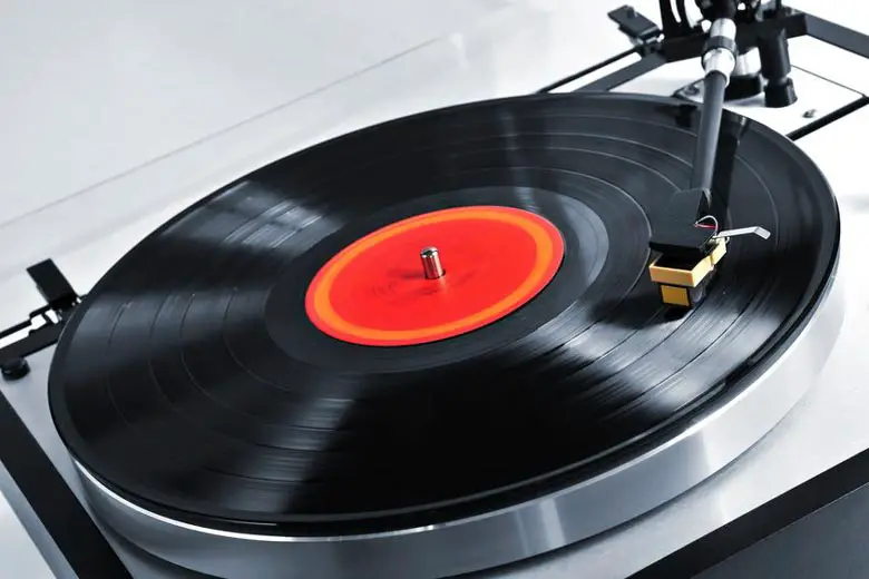 Playing record on turntable