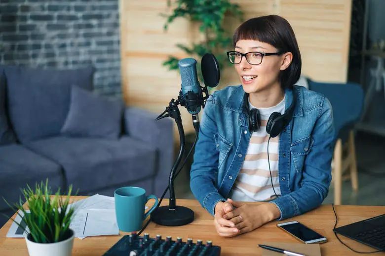 Woman using headphones for podcast