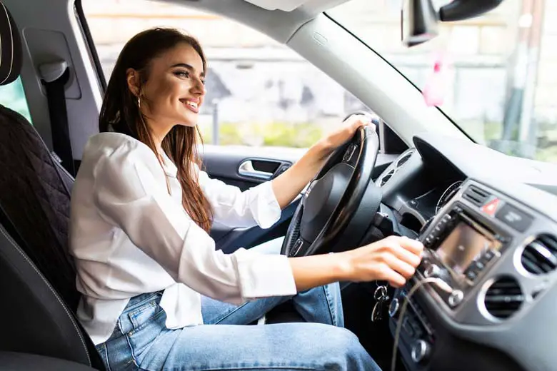 Woman listening to good sounding car speakers