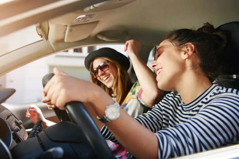 Women enjoying good car speakers